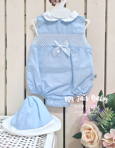 Blue smocked baby romper with matvhing hat.
